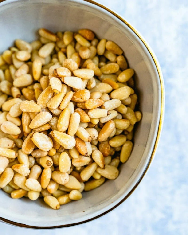how to roast pine nuts for a salad
